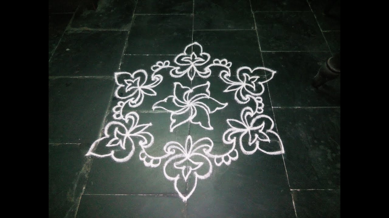 SIMPLE DOTTED KOLAM WITH 7-4 DOTS