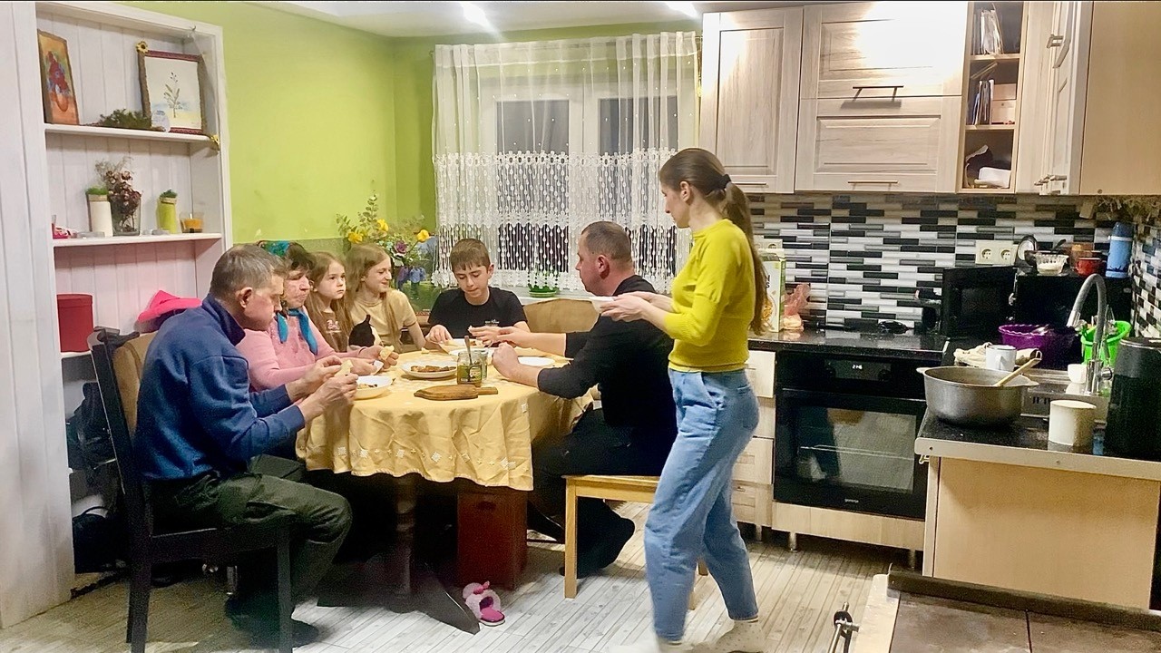 One day of friendly life of a young family in a highland village in winter