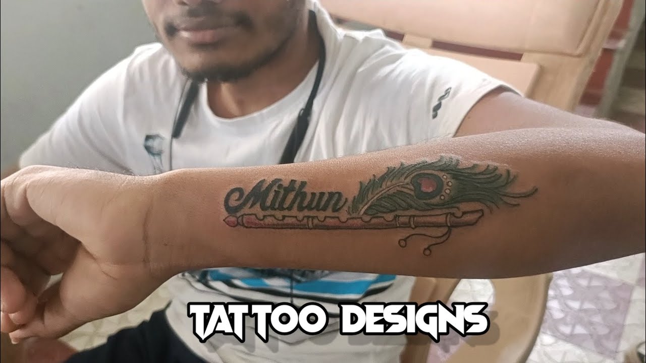 name tattoo designs // feather tattoo design