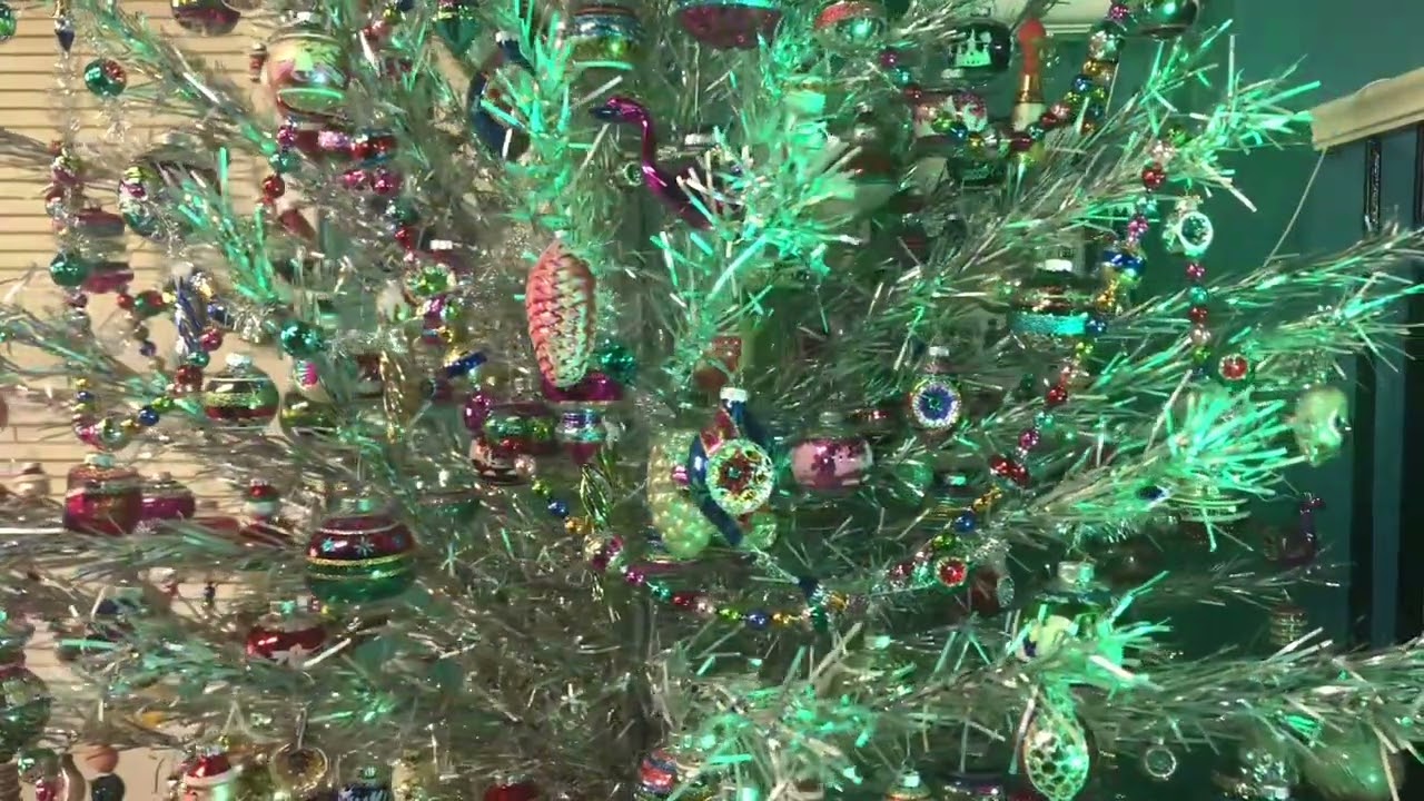 Vintage aluminum Christmas Tree with Shiny Brite Ornaments. Old color wheel.