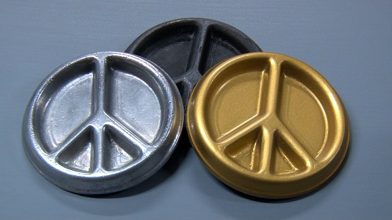 Aluminum metal sand casting of a 3D printed peace sign