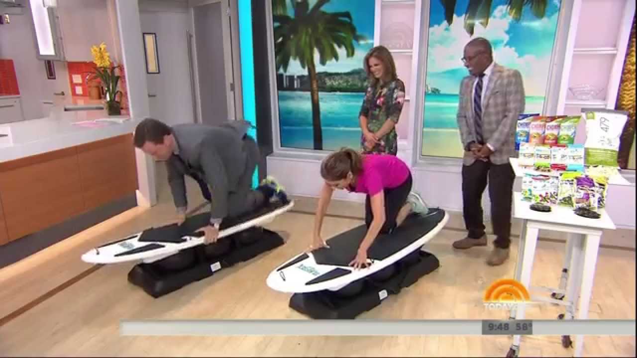 Natalie Morales - surfing in a slit skirt & no high heels - September 12, 2014