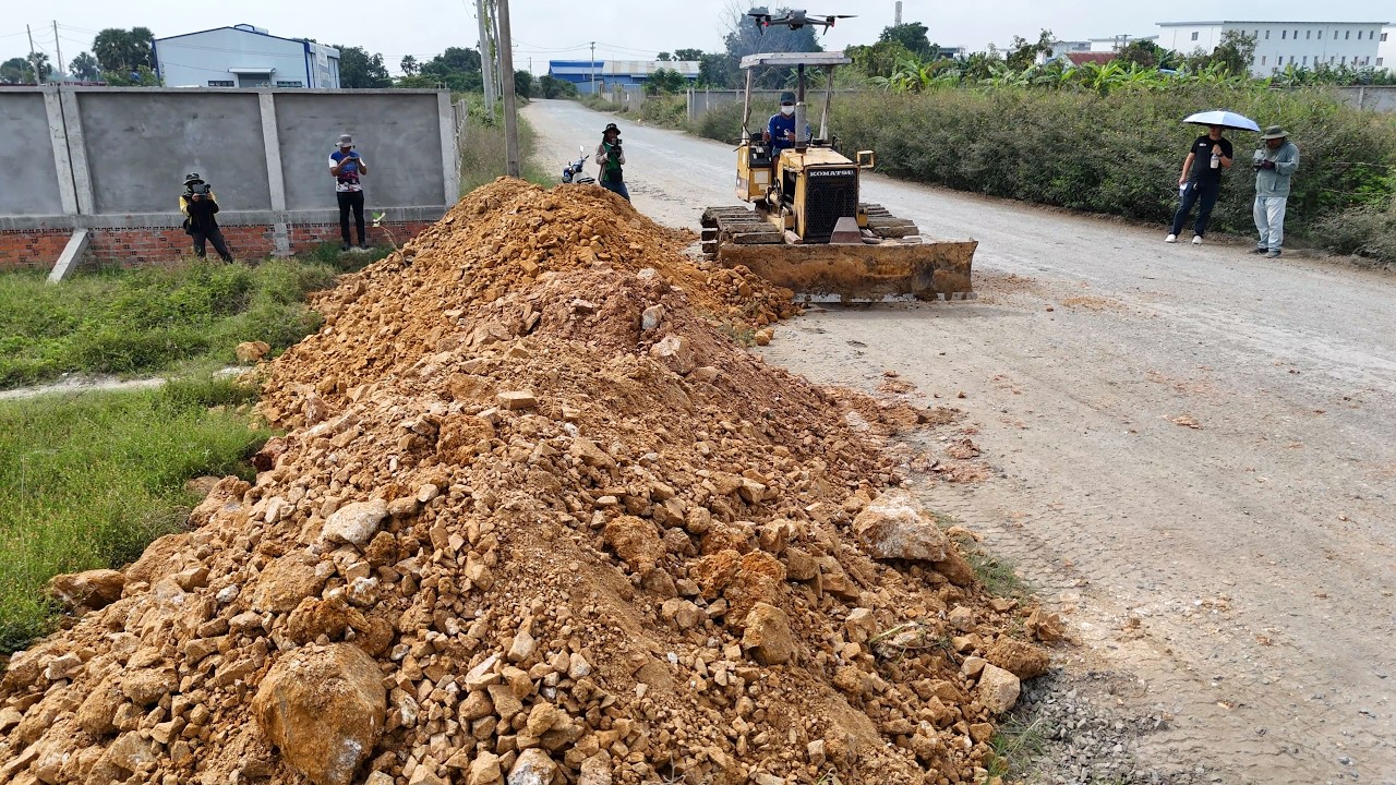 New Site in Action! teamwork with KOMATSU Dozer & 6-Wheel Dump Trucks transforming flooded land.