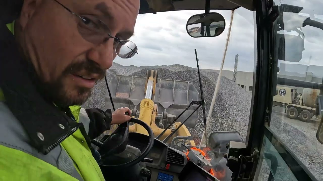 WHEEL LOADER PUSHING STOCKPILE