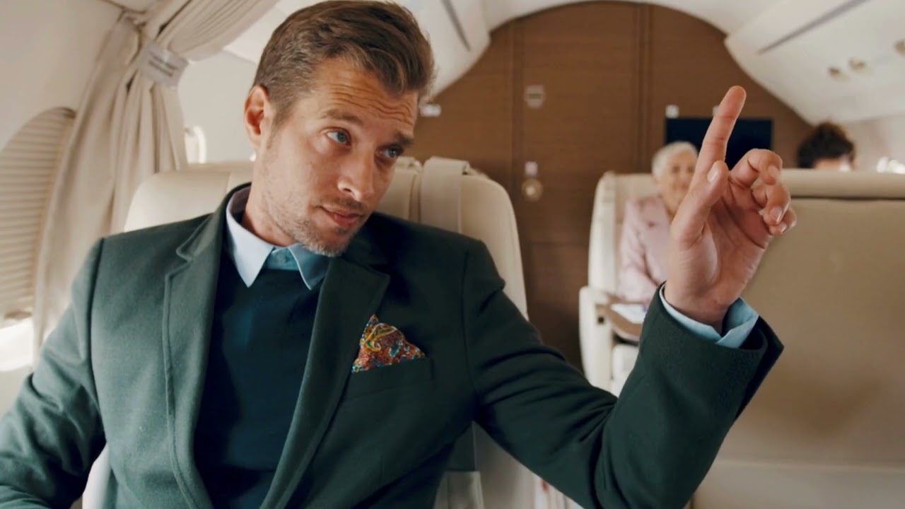VideoVault Stock Video: Businessman calls the stewardess in a private jet