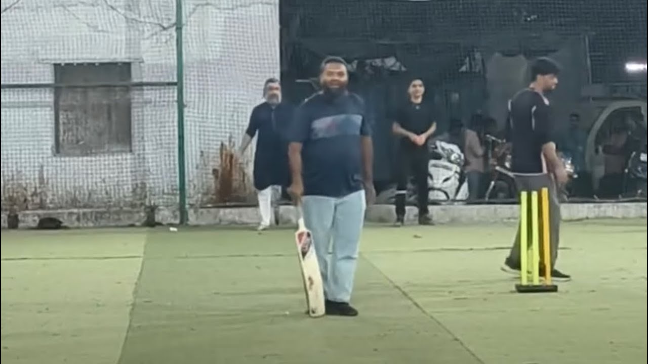 Playing cricket with family.