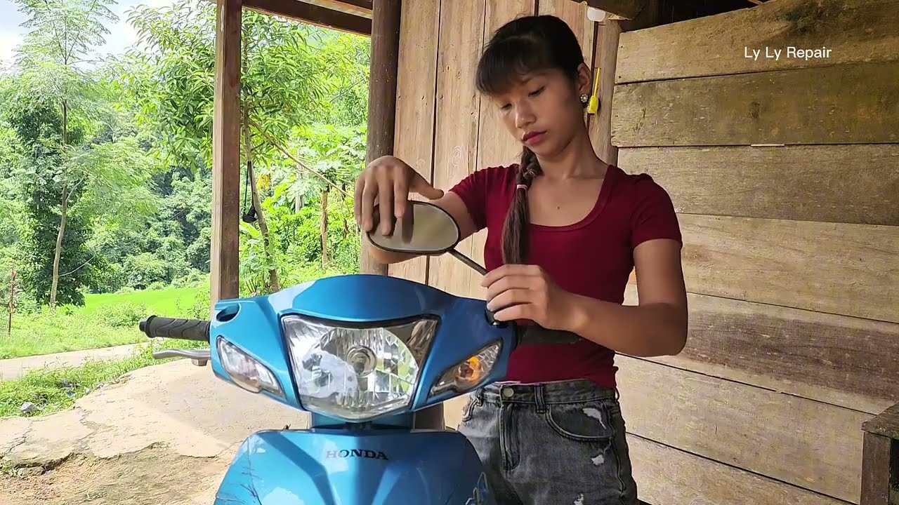 The talented girl successfully changed the tire for the customer.