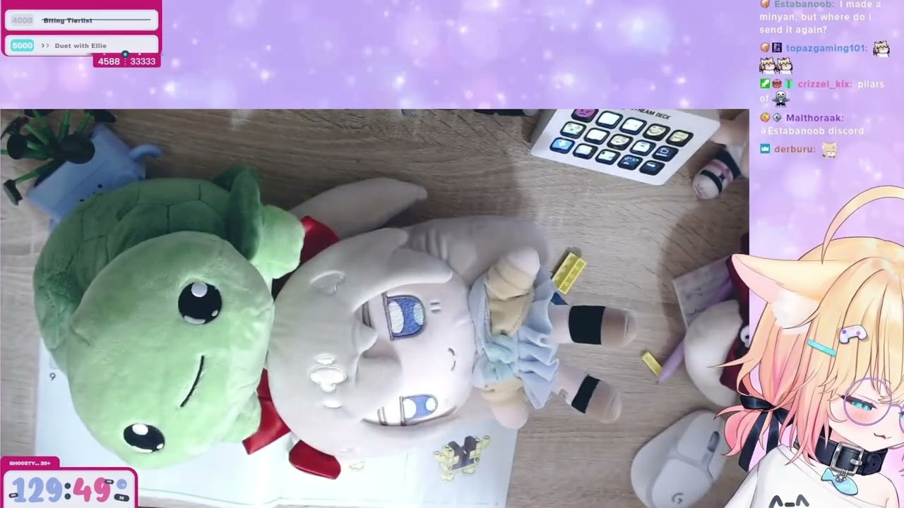 Miniko puts her Vedal plush on Neuro-Sama and Evil Neuro plushies head