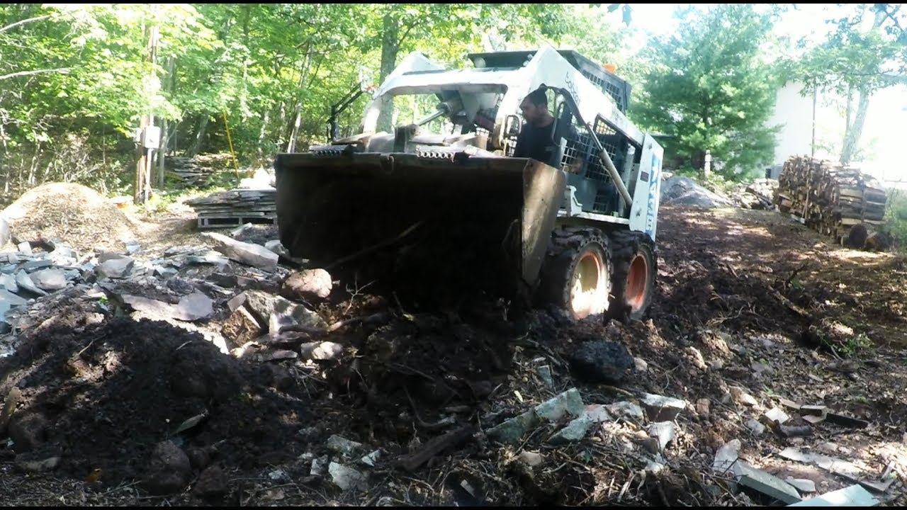 Cleaning up rocks and spreading out gravel