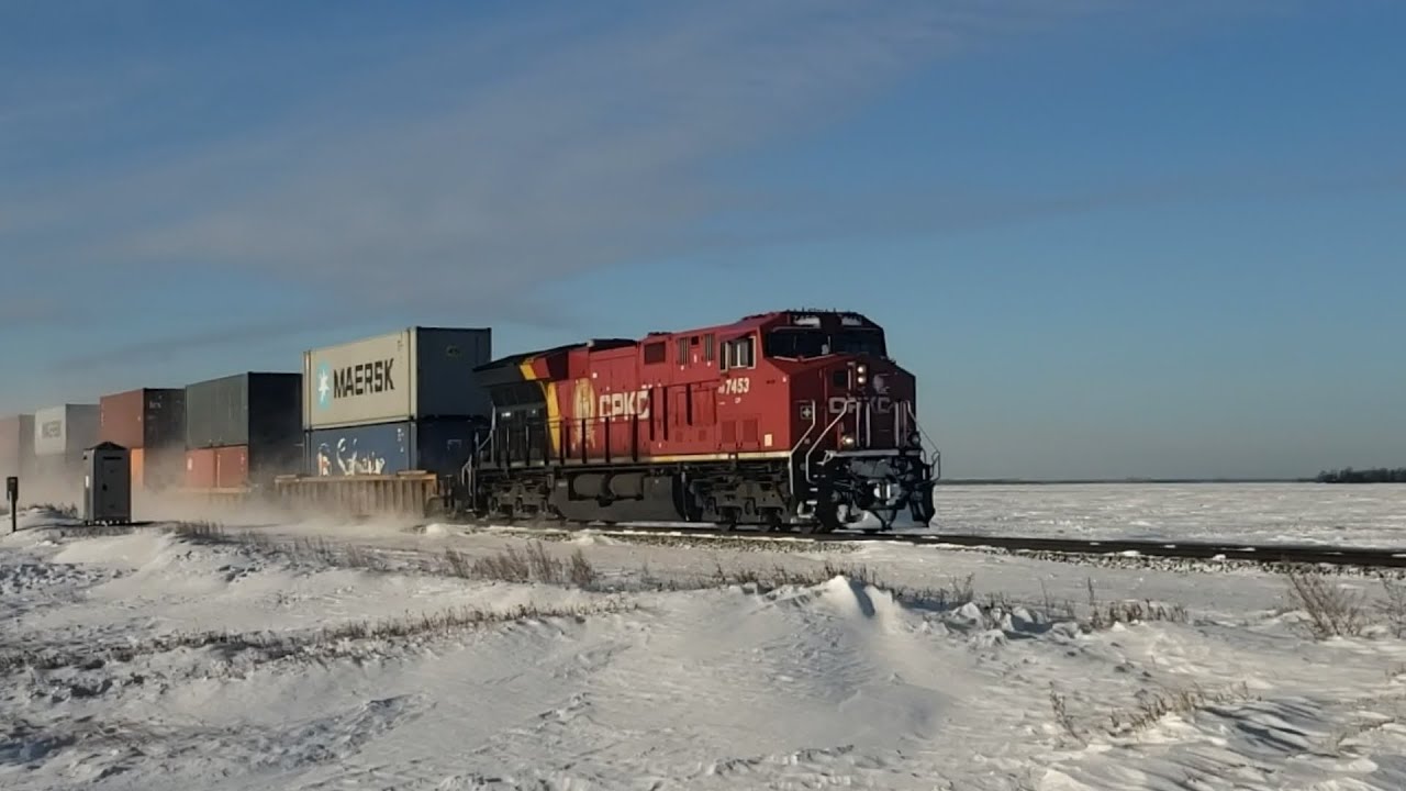 CPKC Railfaning Carberry subdivision 4 Engines plowing thru the snow cloud with the intermodal train