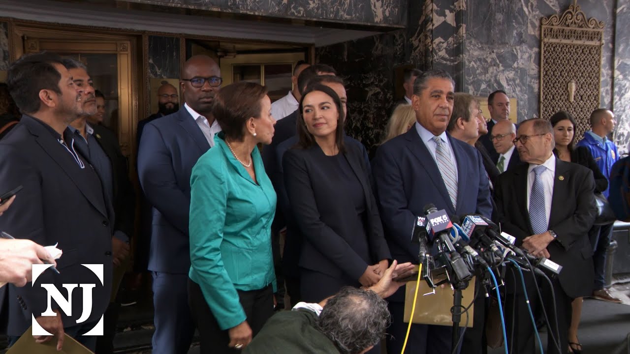Democrats tour migrant hotel amid anti-immigrant protests