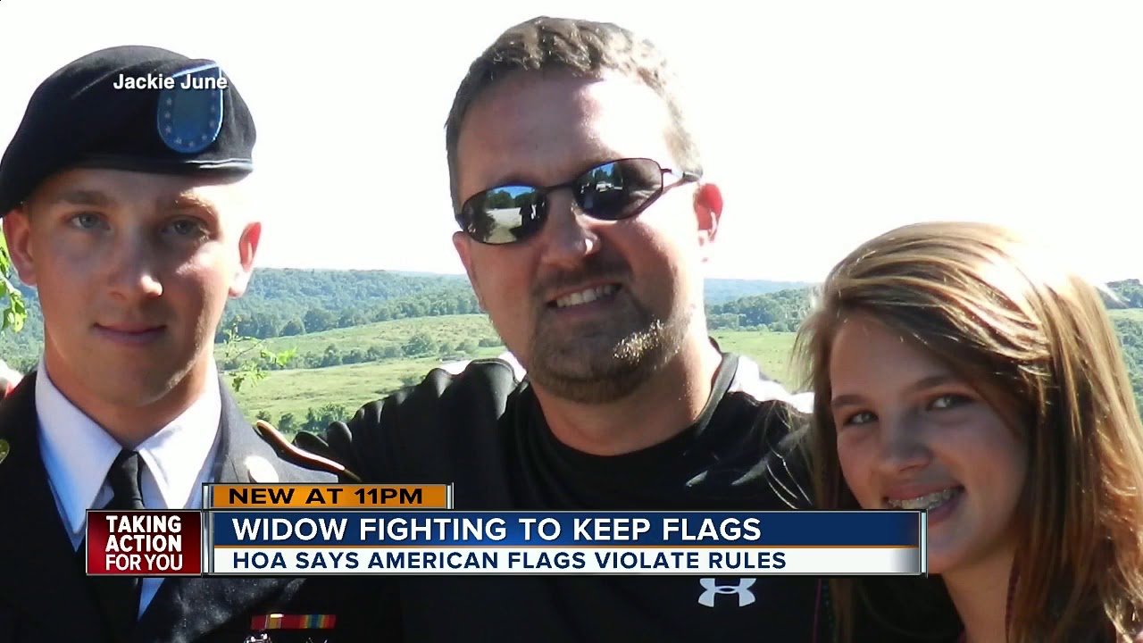 HOA orders homeowner to take down American flags from yard