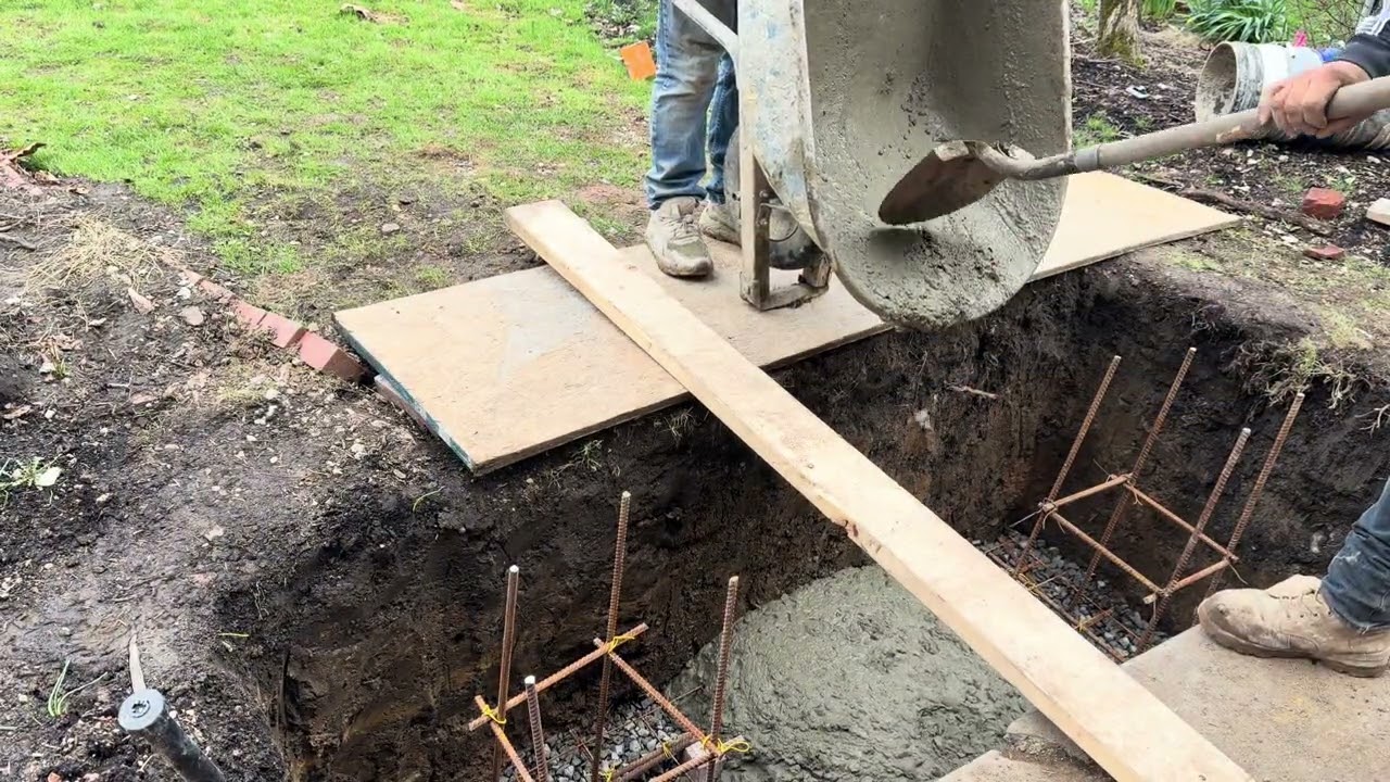 Pouring concrete in the new footers for the porch brick columns#hardwork #work #fun #satisfying #job