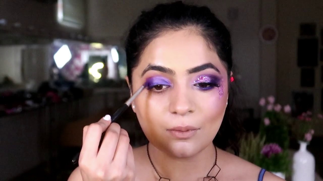 A look thats all out : Purple smokey eyes with chunky glitter