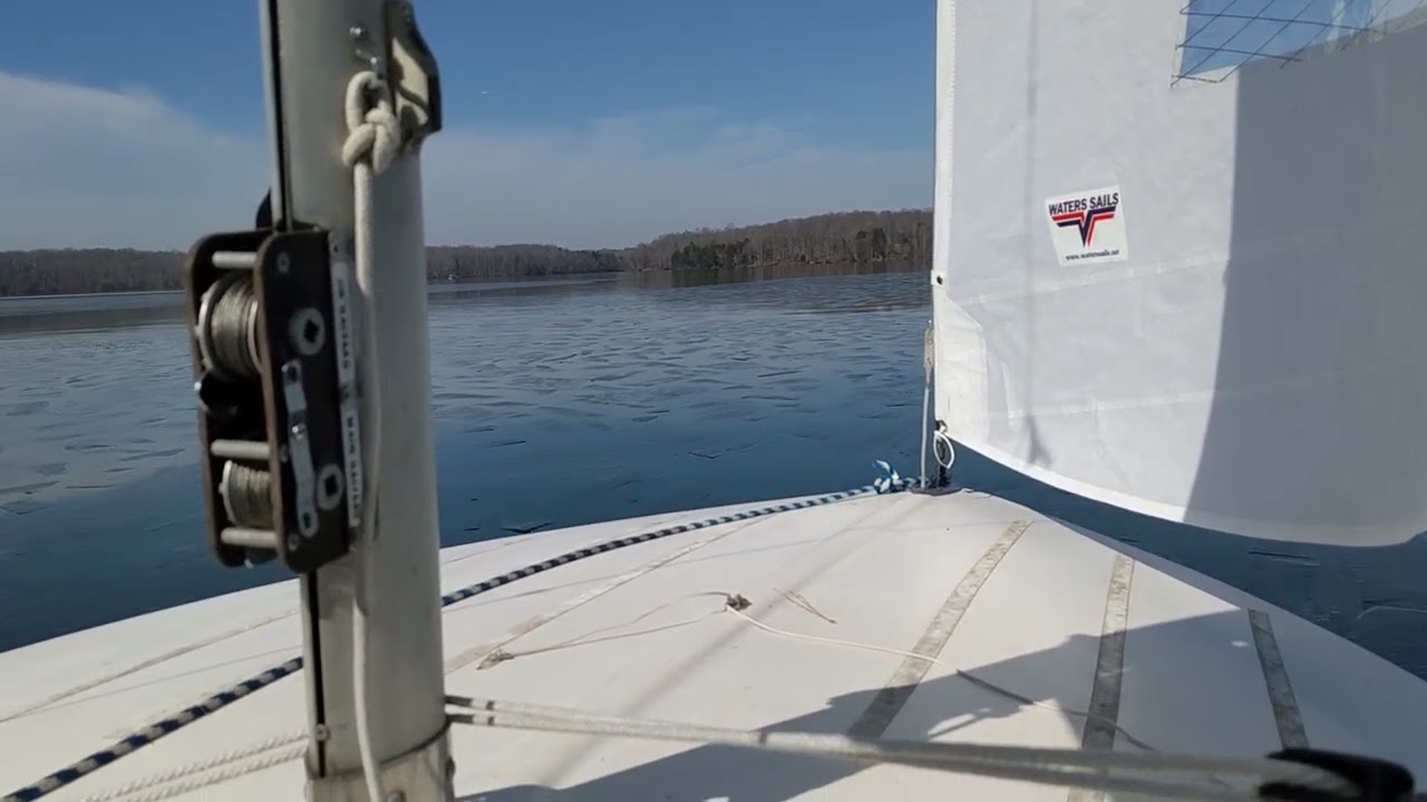 Flying Scot Busting Through the Ice at the Lake Townsend Frostbite Race on 2/15/2026