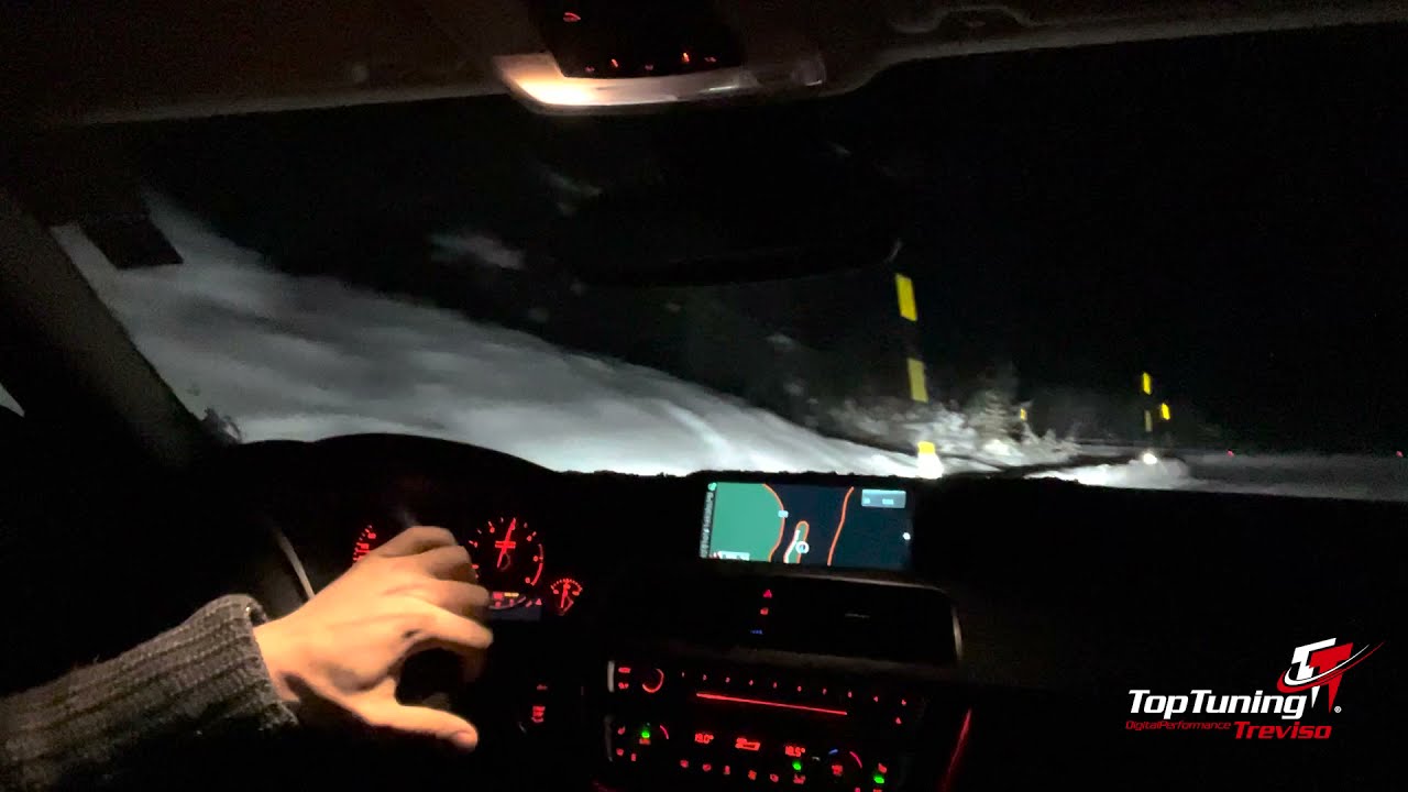 Drifting through a snowed Passo Val Parola in a Bmw Alpina D3 Touring RWD