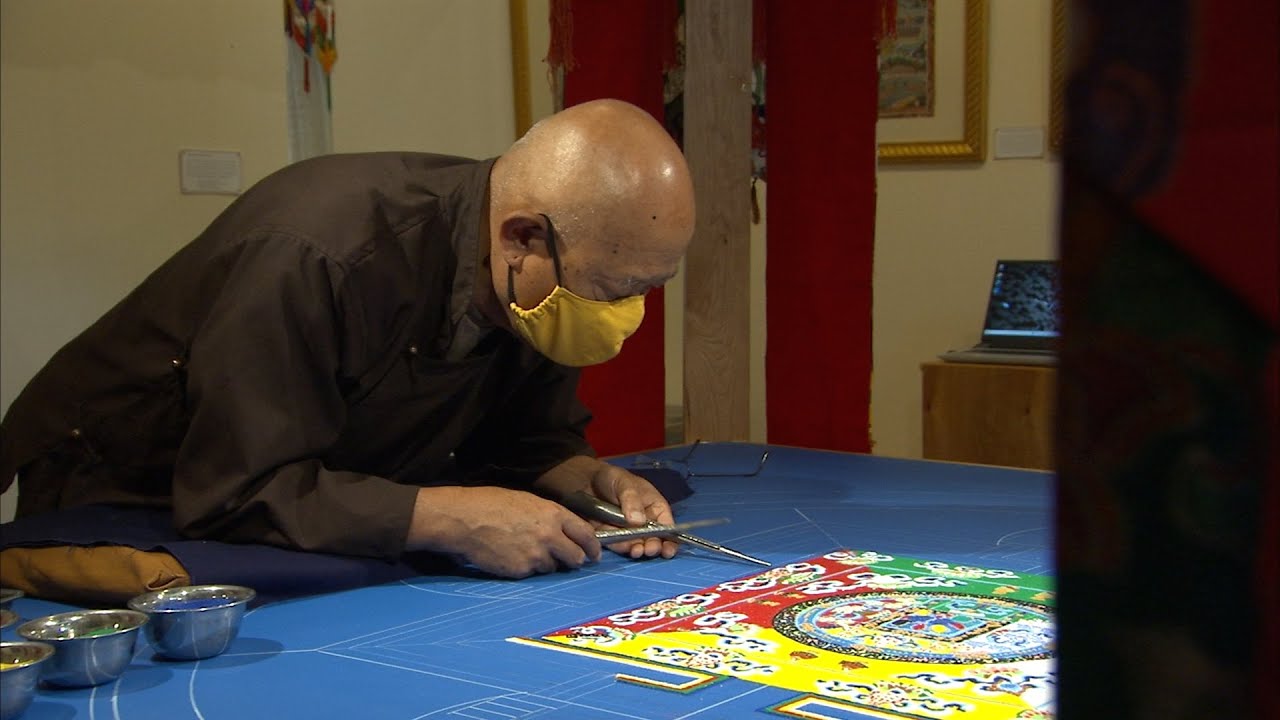 Mandala Master praying ancient art will bring peace.