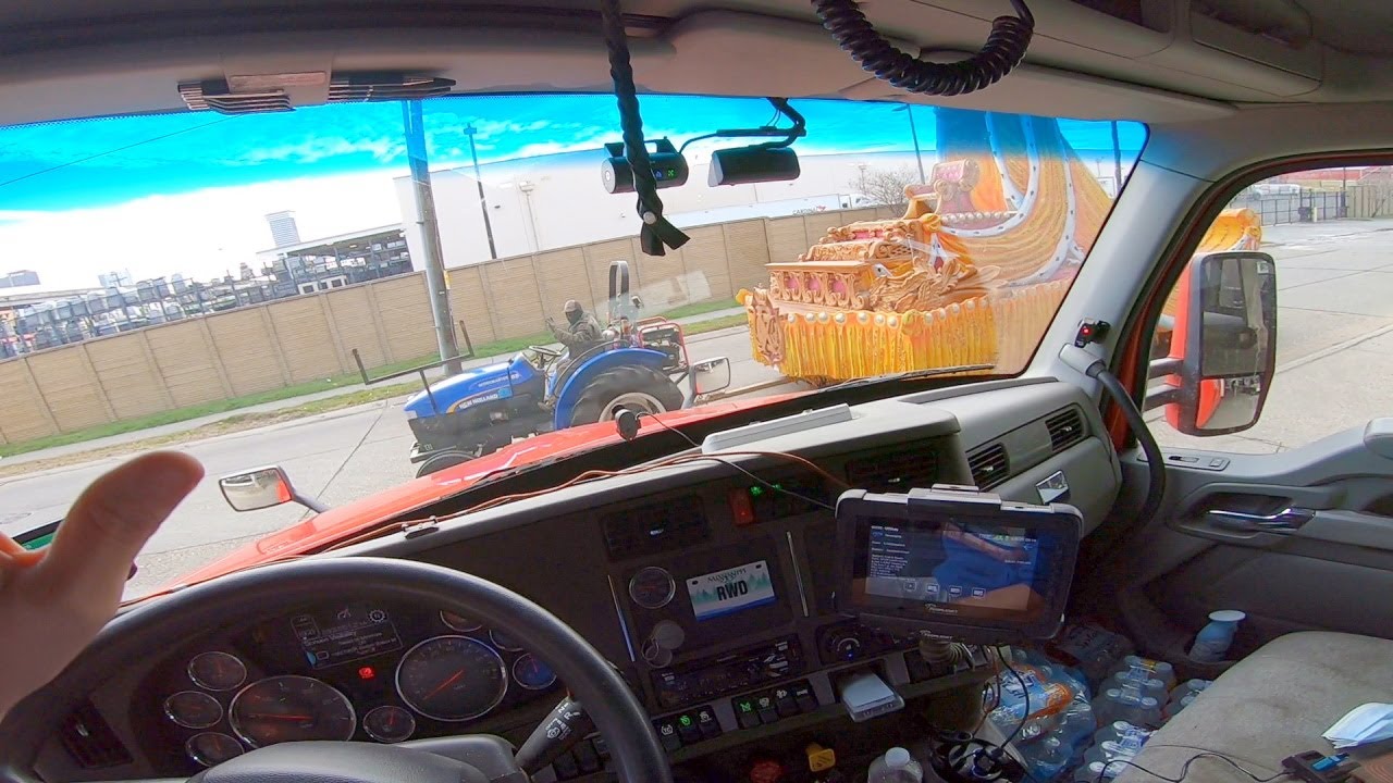 Trucker gets caught up in Mardi Gras Parade.  Rookie Trucking Life.