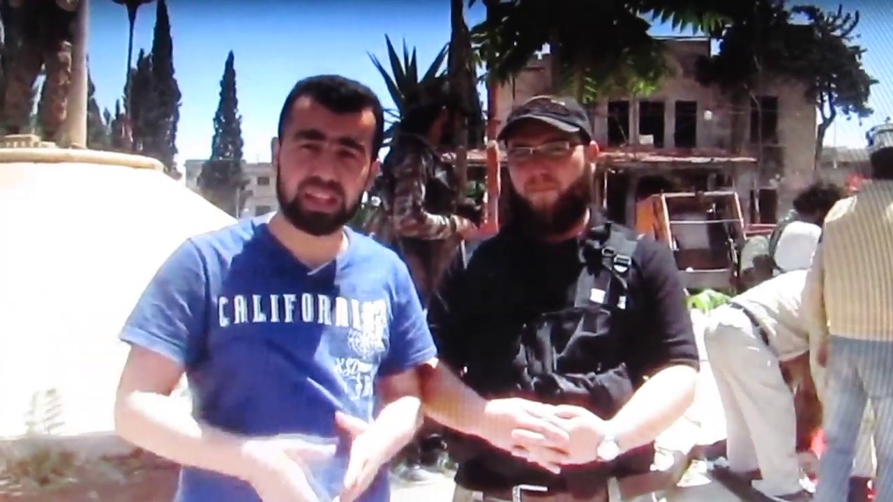 White Helmets stand on Syrian Flag with Al-Qaeda Fighters