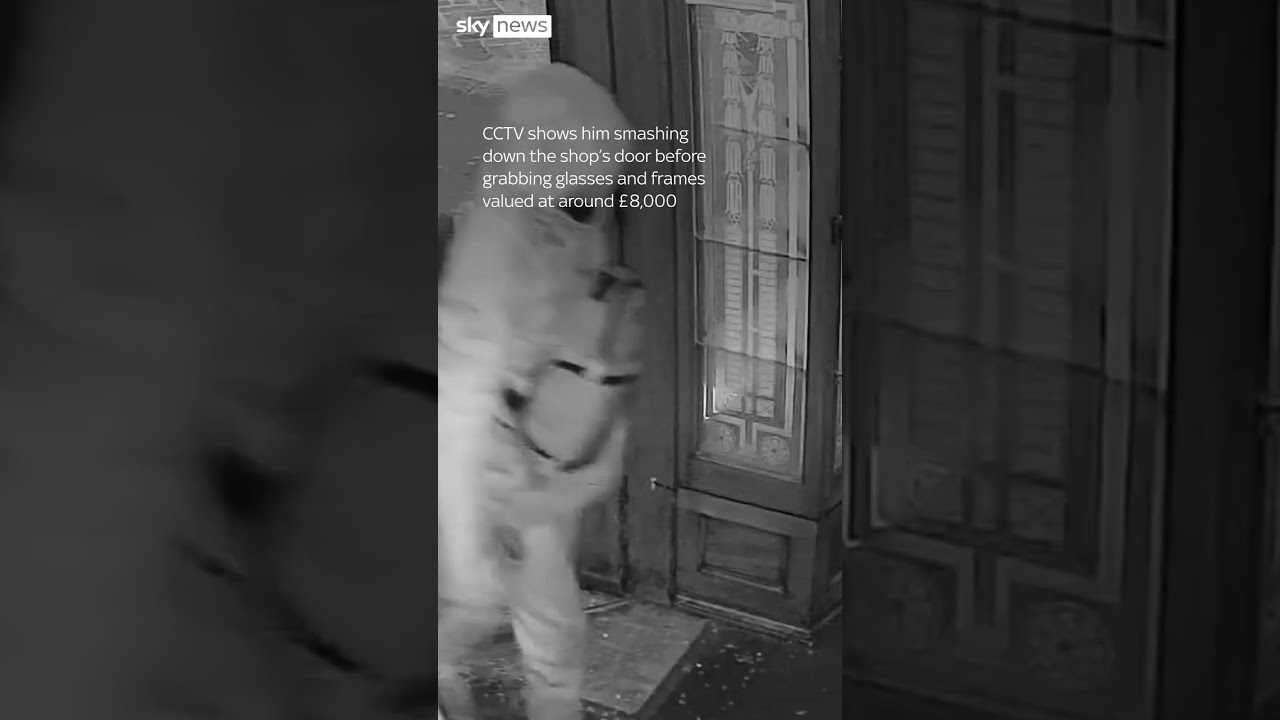 Moment police find burglar hiding in bin