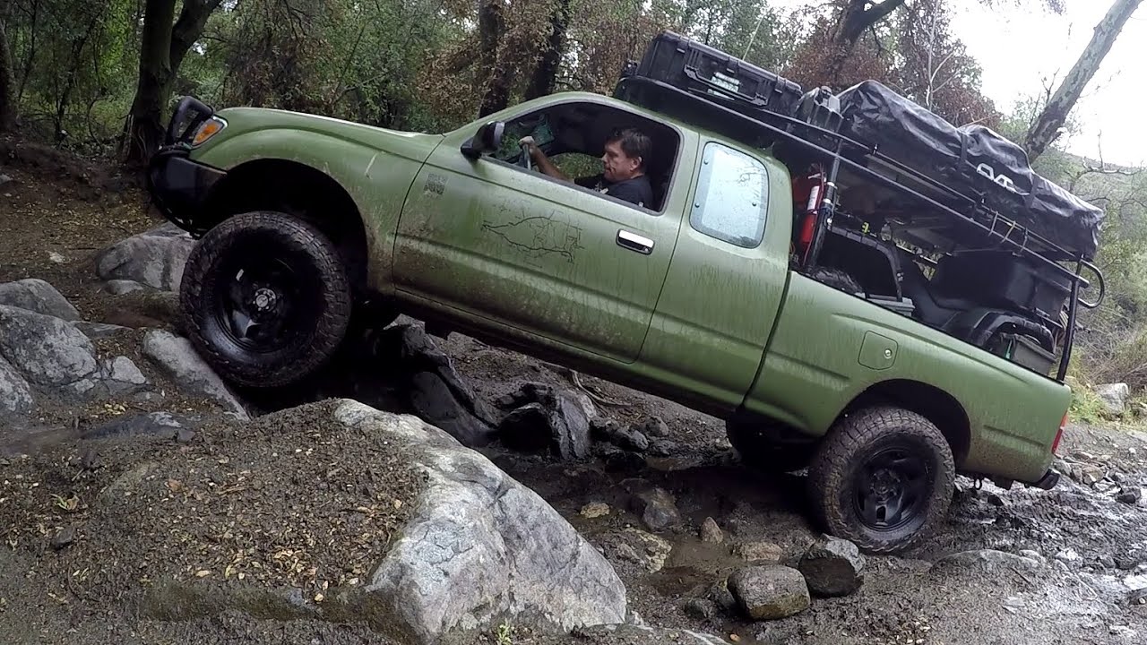 Playing in mud. (First rear locker and front LSD test) 96 Tacoma