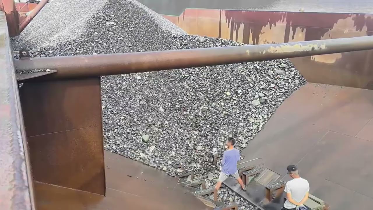 Barge unloading 3200 tons of cobblestone - relaxing video, the flow of the rocks is great