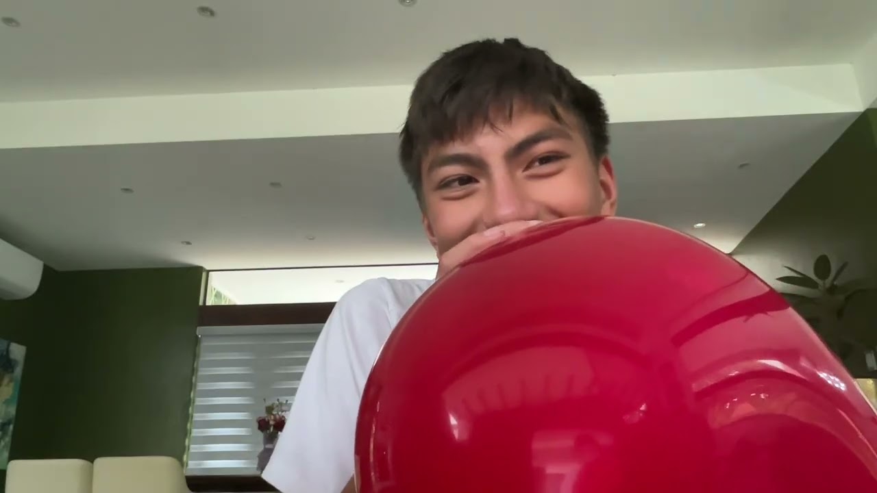 Blowing the balloon until it pops
