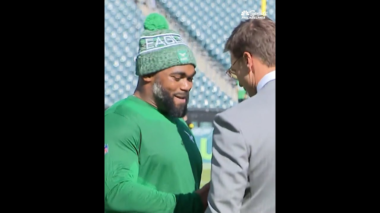 Brandon Graham runs into Tom Brady during pregame Eagles vs. Giants