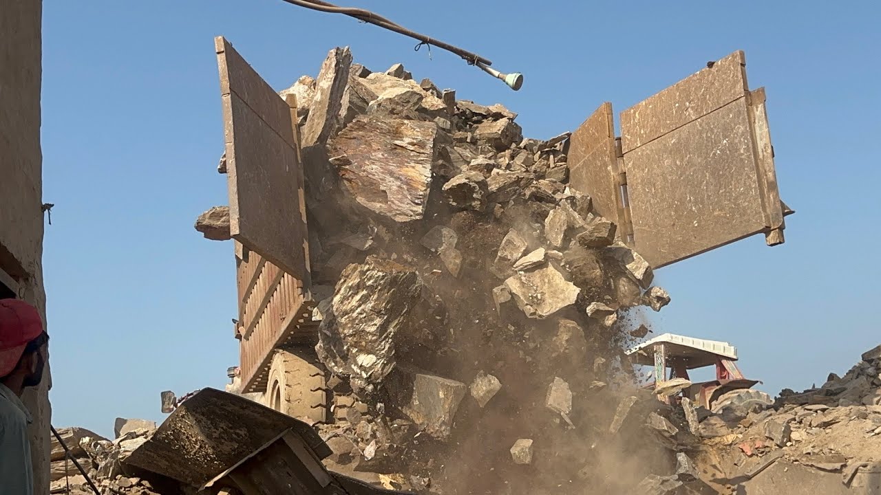 Powerful Machine Crushing Huge RocksGiant RockCrushing Machine at WorkMassive Rocks Being Crushed by