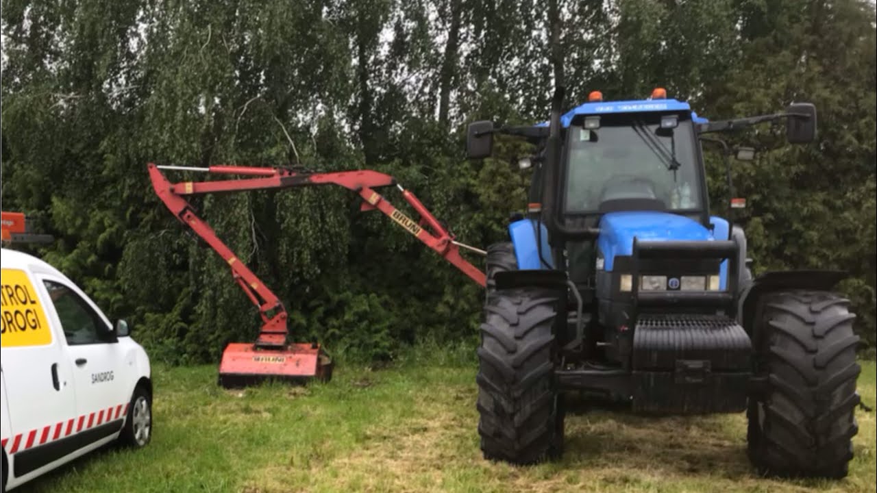 Jak wygląda koszenie poboczy? Praca kosiarką  na wysięgniku Bruni oraz New Holland TM 160