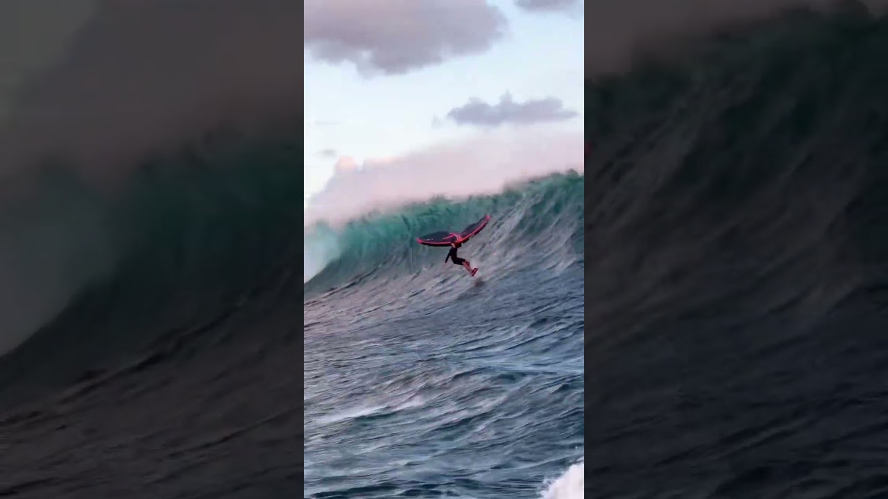 Wing foiling a crazy massive wave! 😱🤯