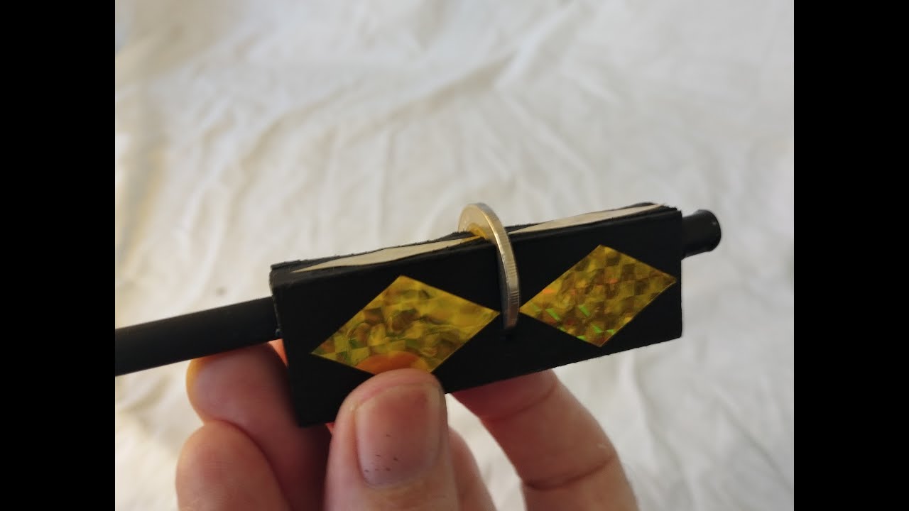 Coin penetration magic trick revealed & how to make.