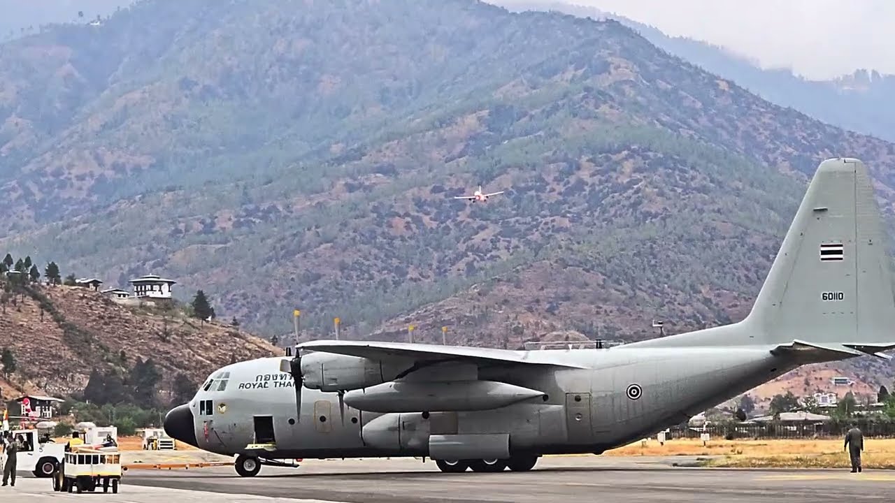 A319 Touches Down at Paro Airport as Royal Thai Air Force C-130 is Towed on the Tarmac.