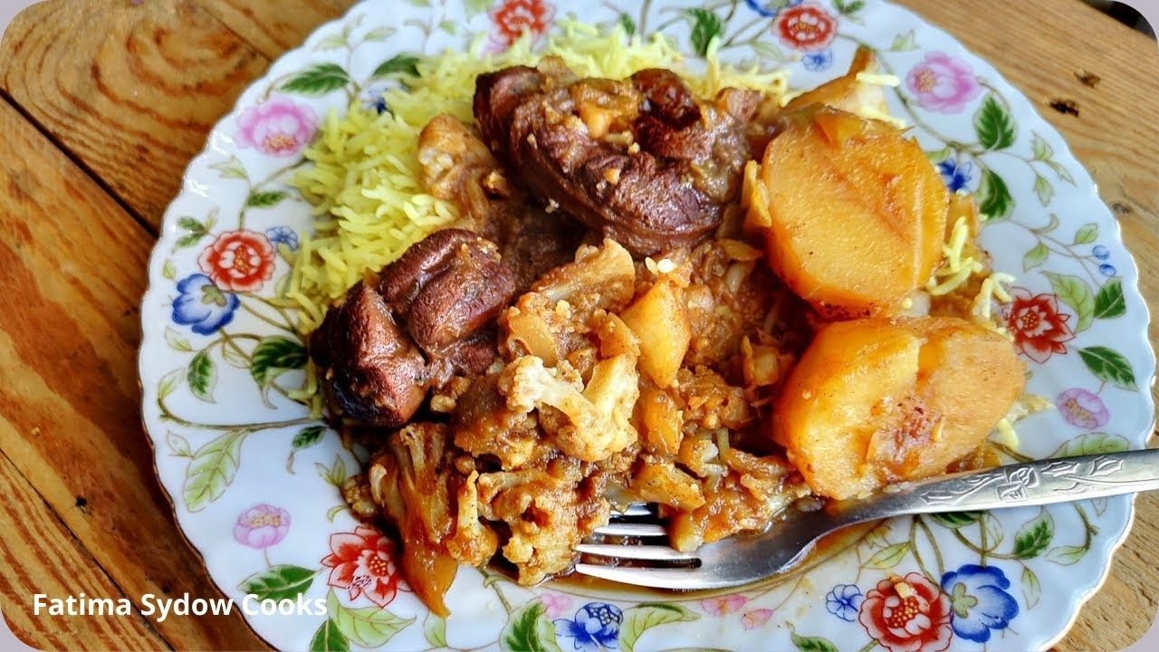 Cauliflower and Cabbage Bredie /Stew. Served with Rice and slaai or  Pickled beetroot.