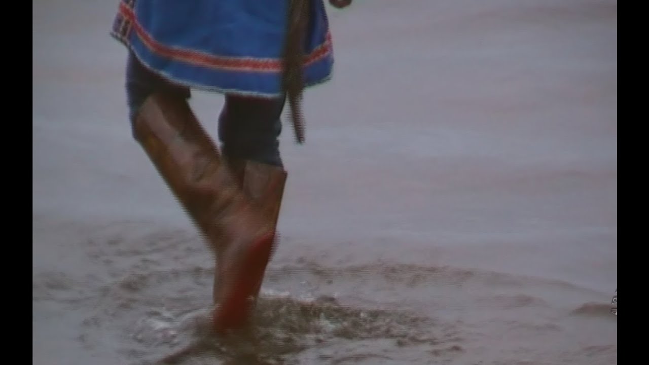 In patterned rubber boots