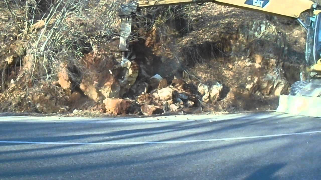 CAT M318D Excavator crushing rock with ''Furokawa'' Hydraulic Hammer