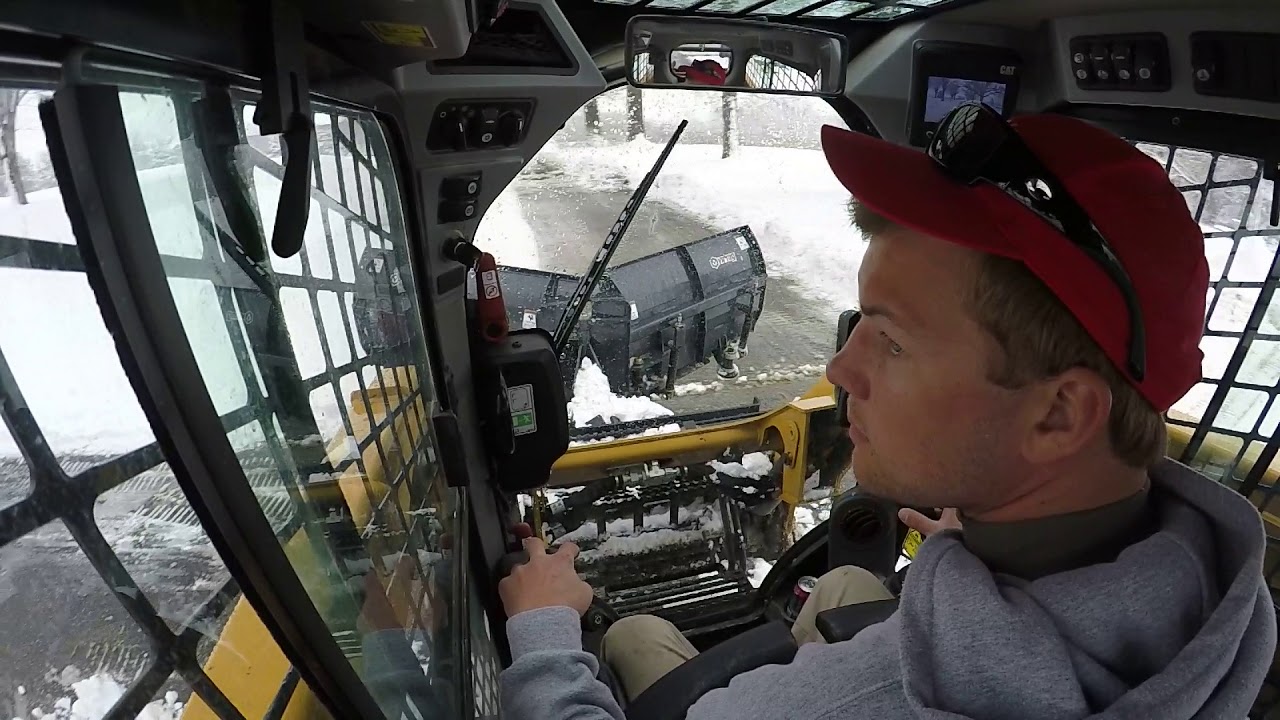 CAT 259D with Virnig V-blade