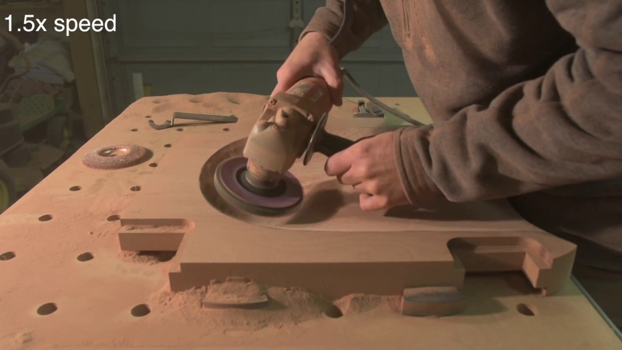 Power carving a Maloof dining chair seat made out of mahogany