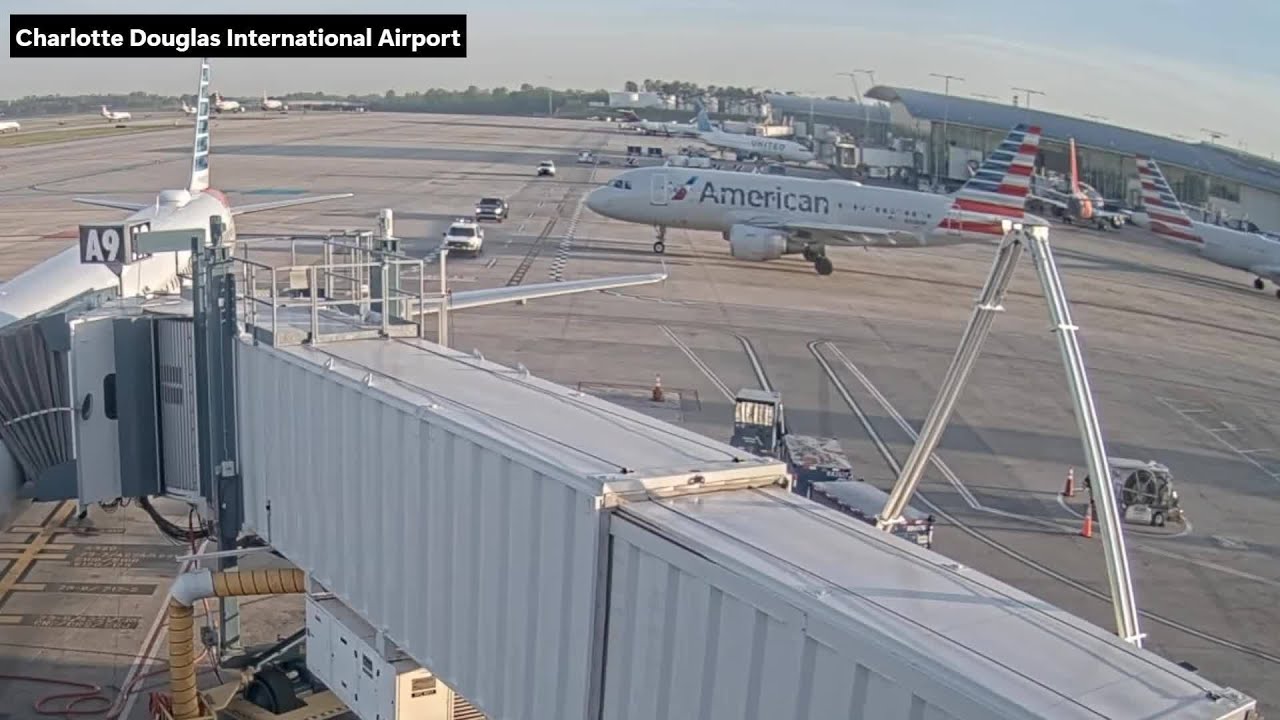 VIDEO: Two CLT Airport vehicles pull in front of taxiing plane