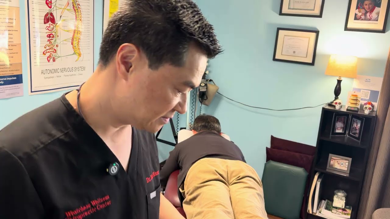 A golfer getting chiropractic adjustment. ￼