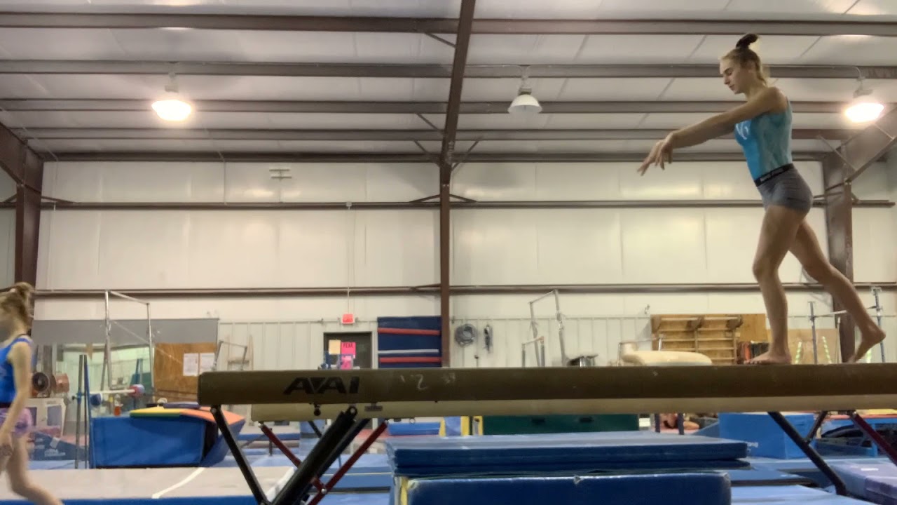 Tour Jete Leap on beam (D)