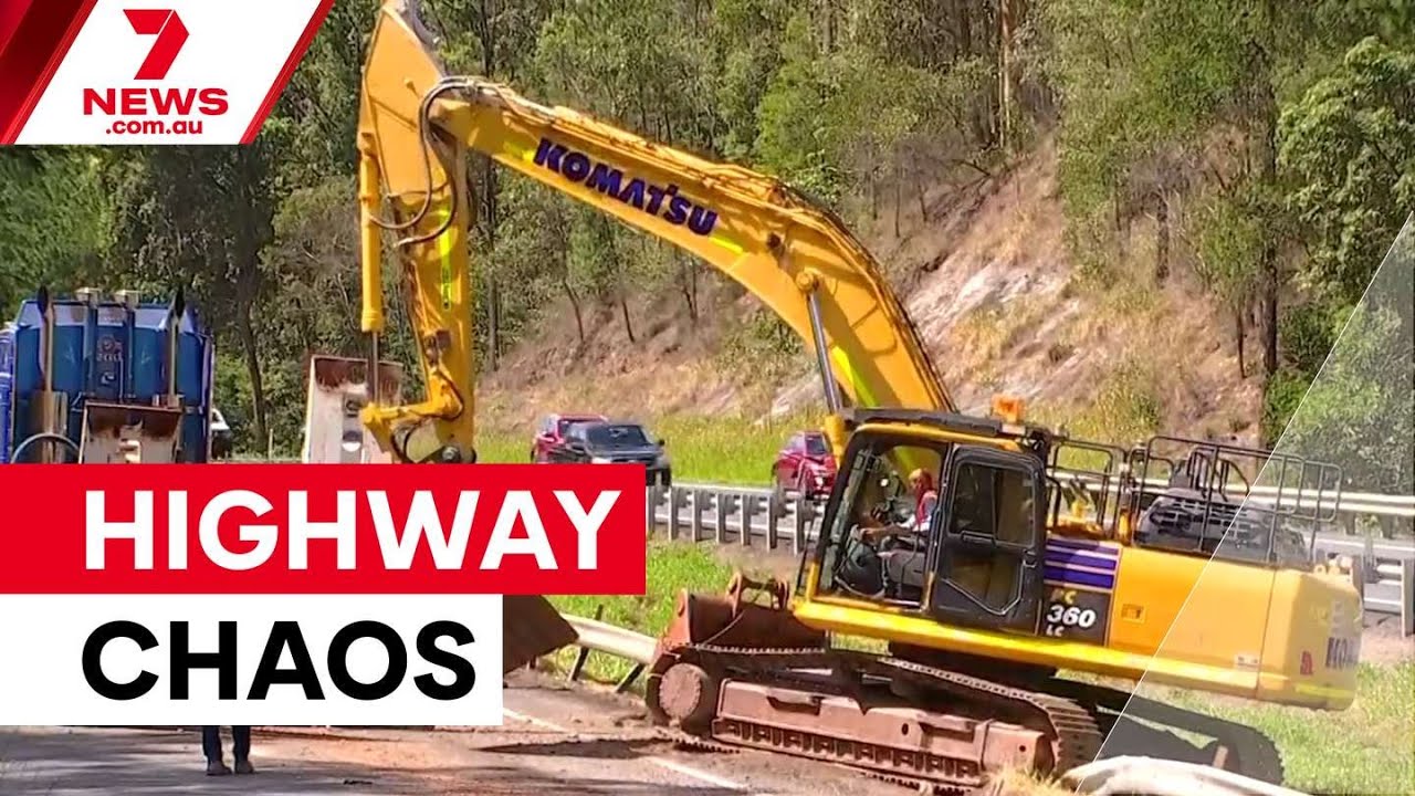 Truck smashes into Bruce Highway overpass | 7NEWS