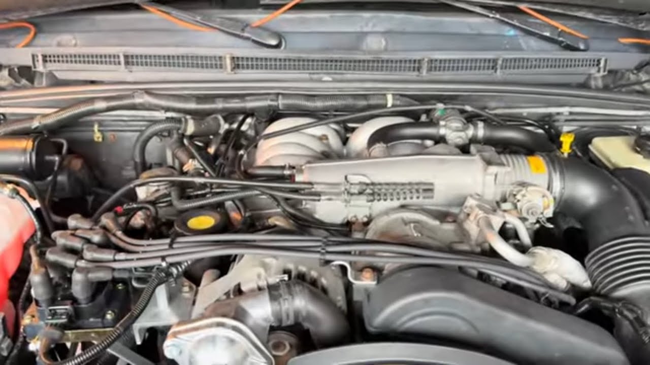 LR Discovery 2 Ignition Coils Relocation Kit, Spark Plugs, and Valve Covers Gaskets Installation. 