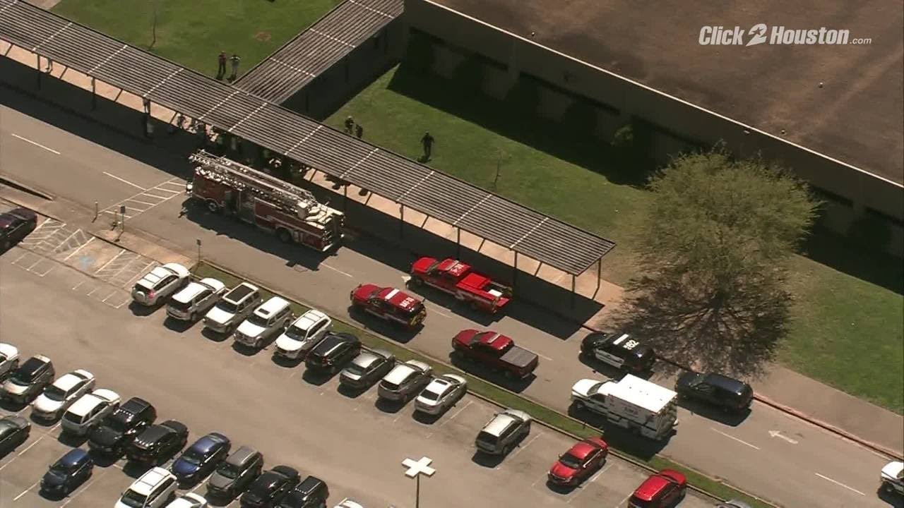 Sky 2 flies over Quail Valley Middle School after evacuation