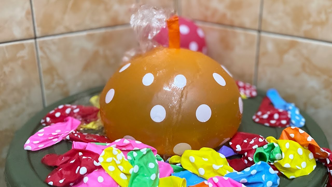 BLOWING BALLOONS WITH WATER, MAKING A LARGE BALLOONS FOUNTAIN AND MANY BALLOONS NOT YET BLOWN UP