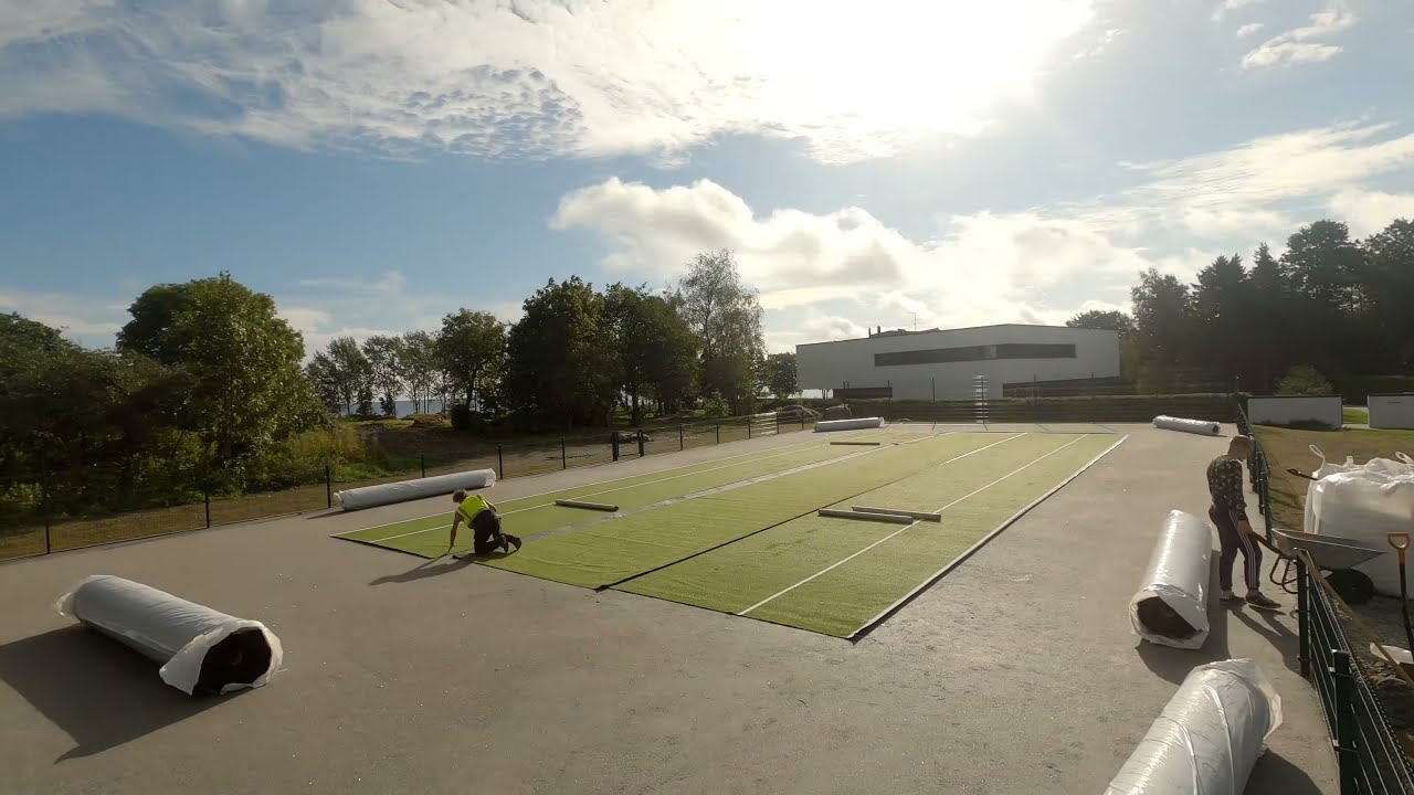 Artificial grass tennis court installation