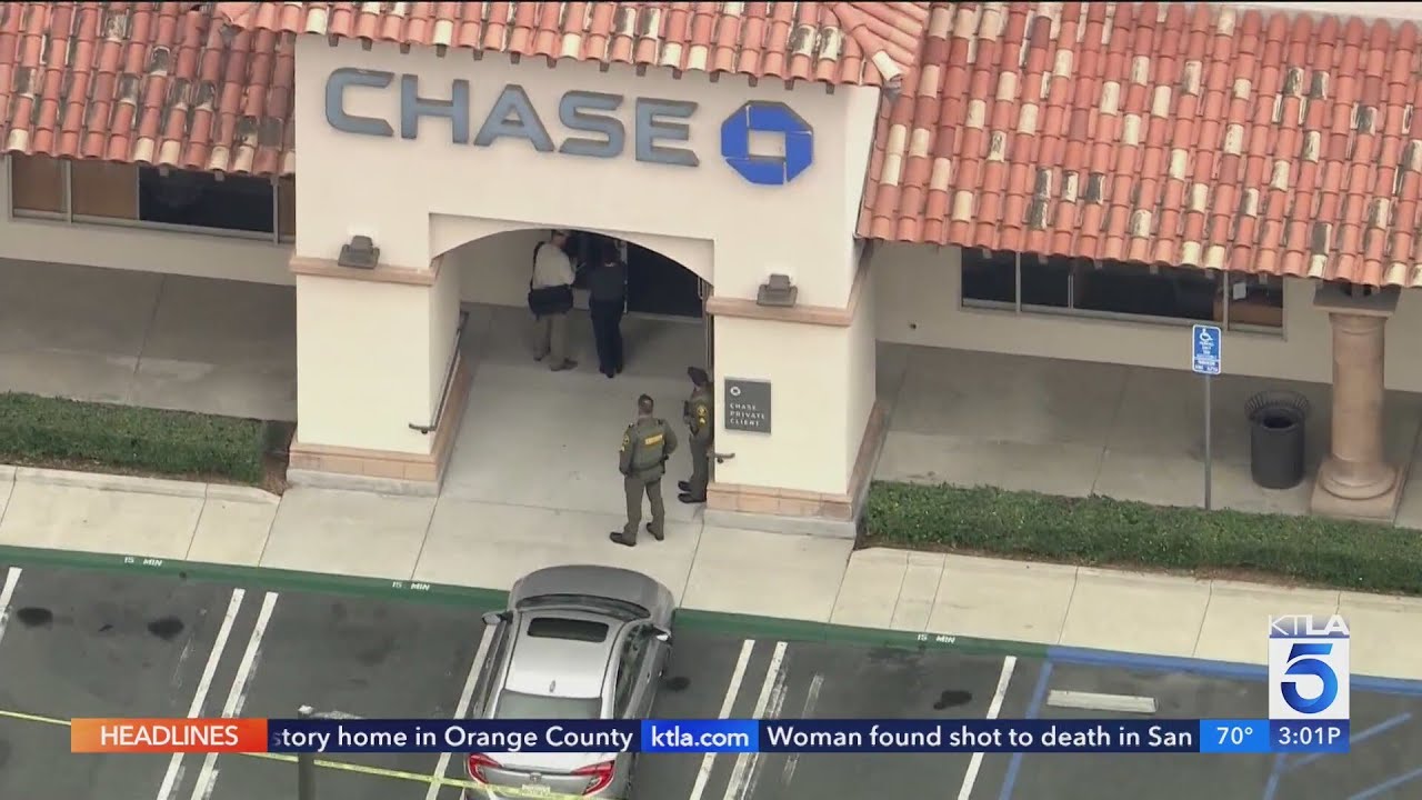 Authorities searching for armed man who robbed bank, prompted school lockdown in Orange County