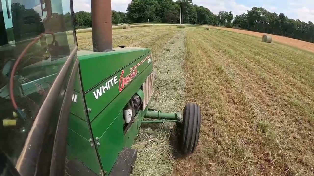 RAKE and ROLL! Making round bales of first cutting hay.