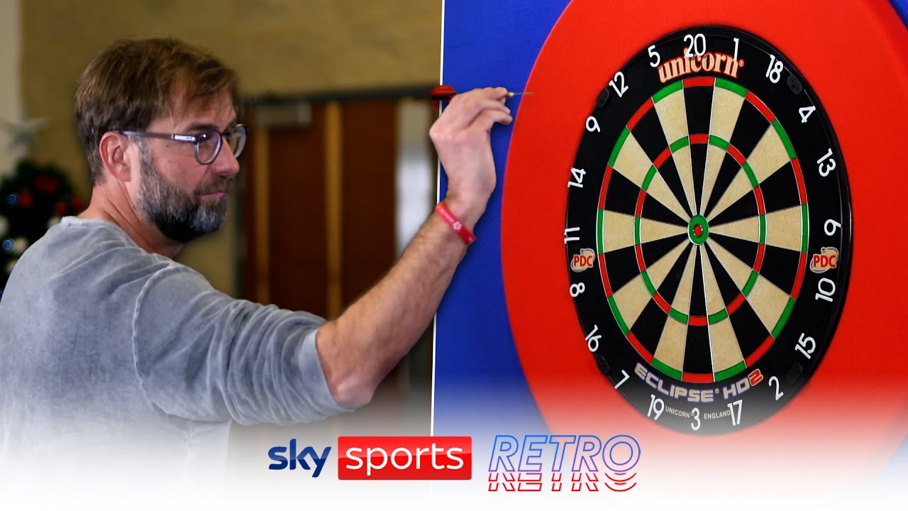 Jurgen Klopp shows off his darts skills in front of Raymond van Barneveld