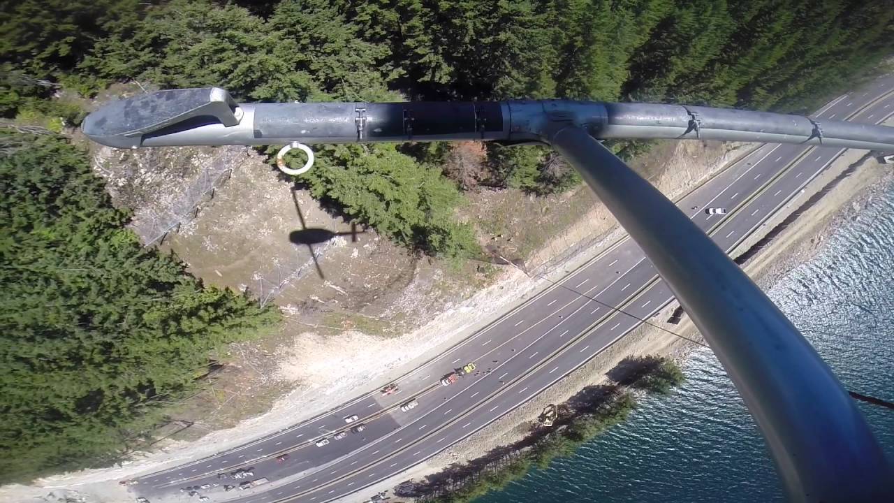 Bell UH-1H  HUEY helicopter hanging rock nets precision longline